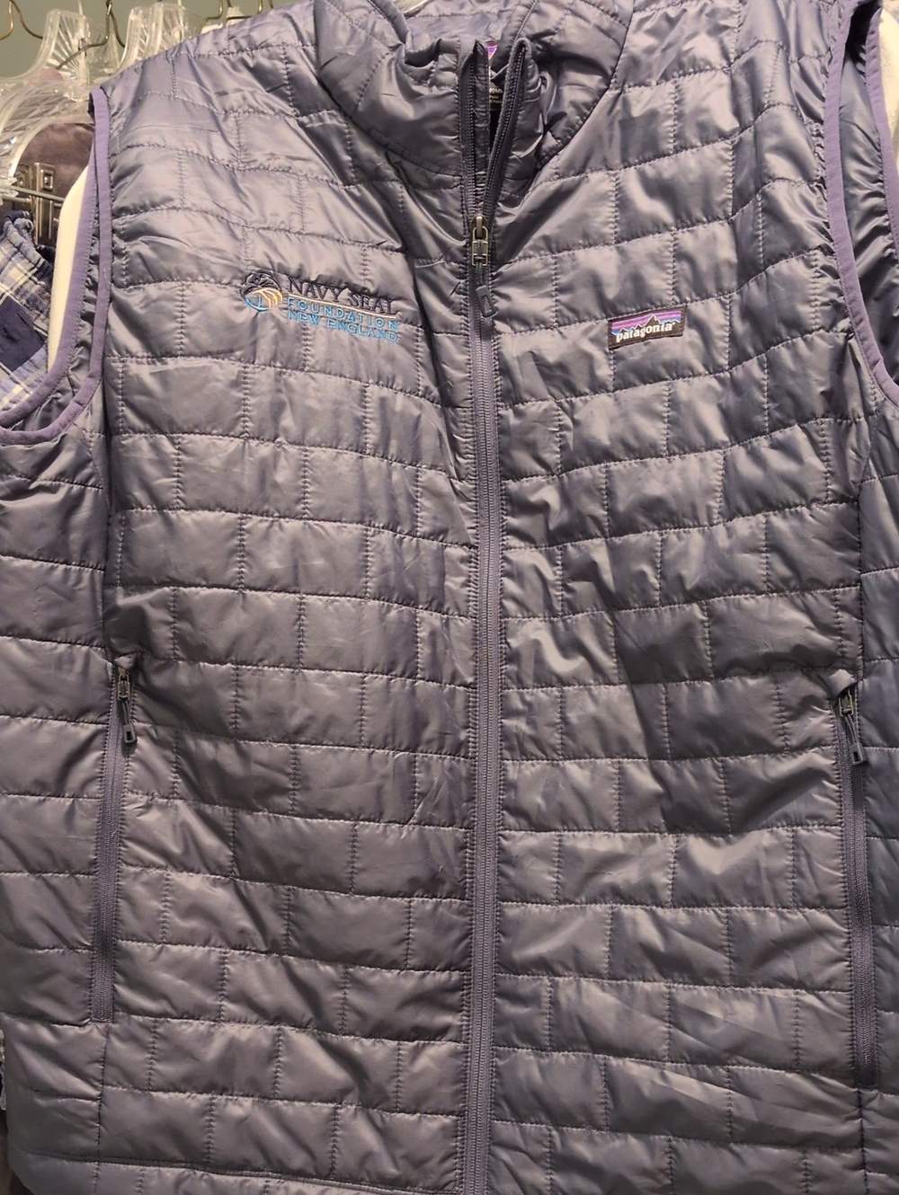 patagonia vest embroidered with navy seal foundation logo. size xxl. blue/gray.